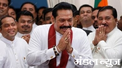 Sri Lanka's newly appointed Prime Minister Rajapaksa gestures during the ceremony to assume duties at the Prime Minister office in Colombo